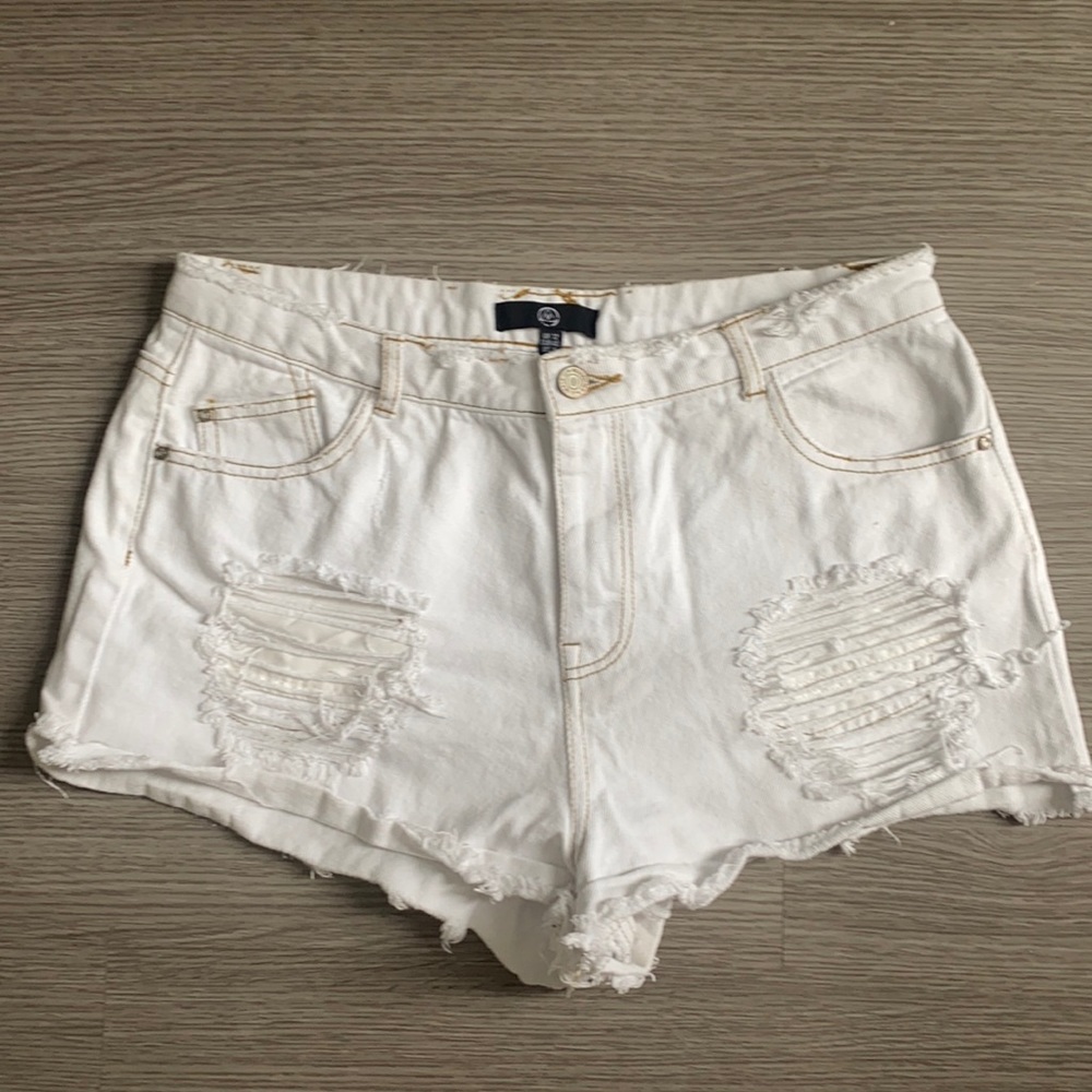 White jean shorts from Misguided. Distressed with gold stitching, lightly worn